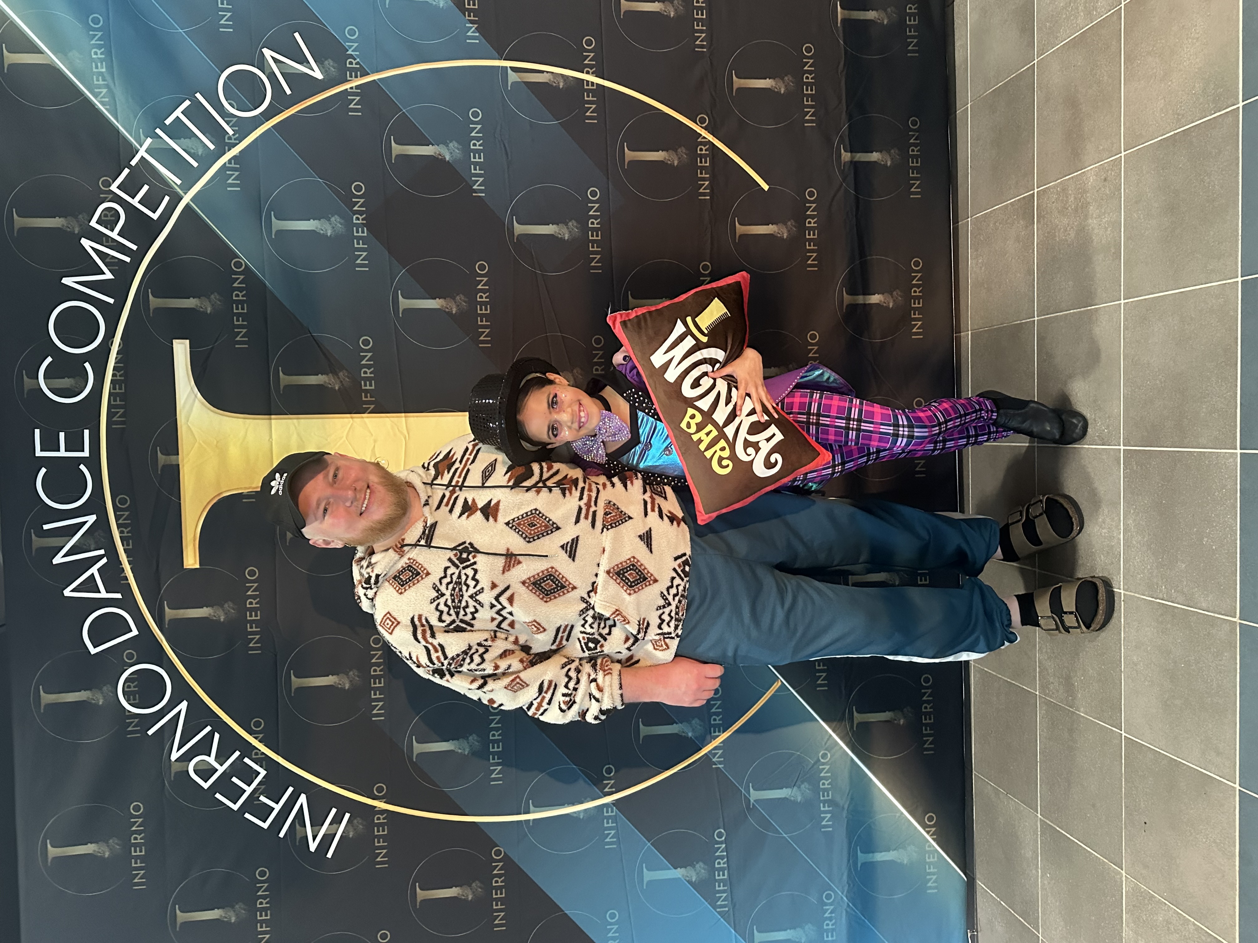 Dixon holding ADCC Studio of Excellence Winner banner