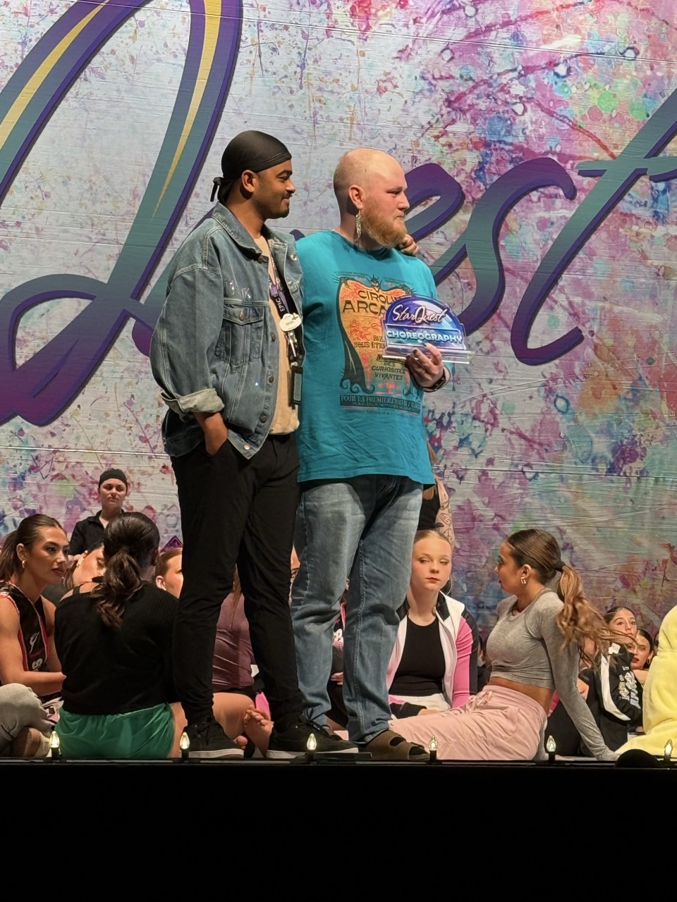 Dixon and Malik on stage receiving competition award