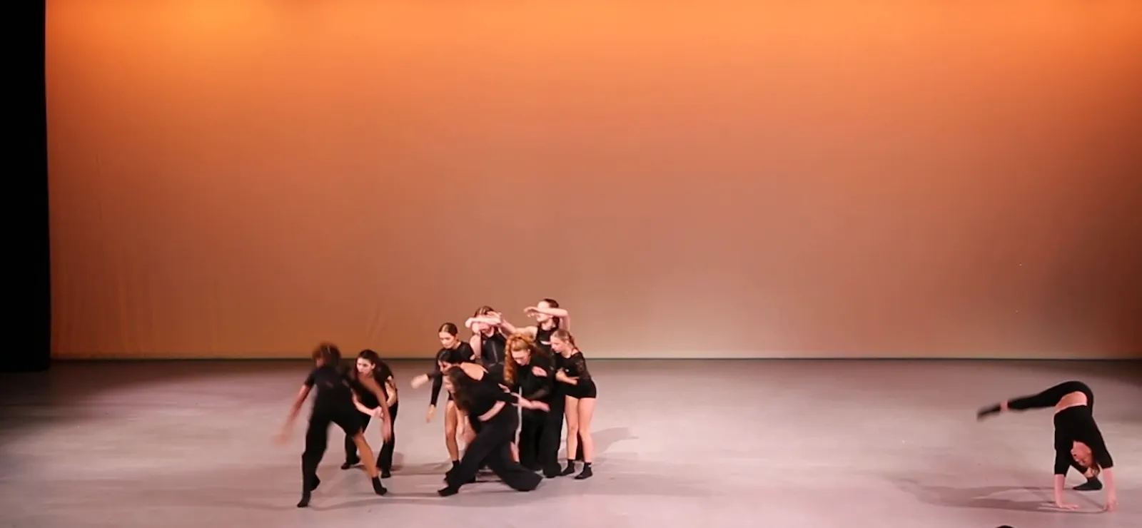 The company gathered together near the end of the piece