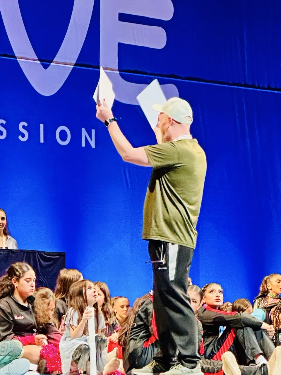 Dixon on stage receiving award at competition