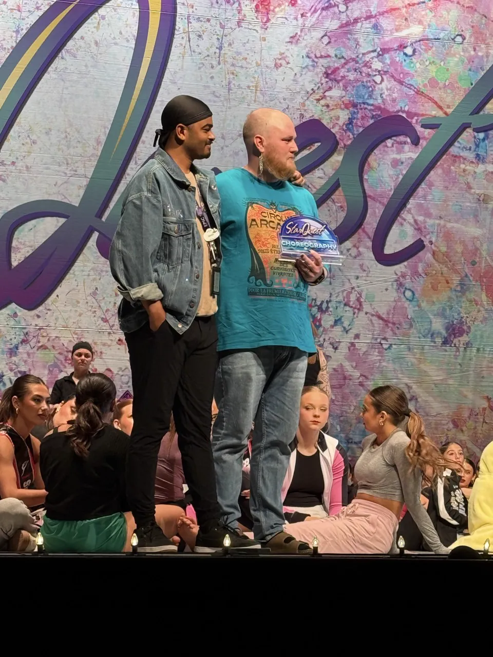 Dixon and Malik on stage receiving competition award