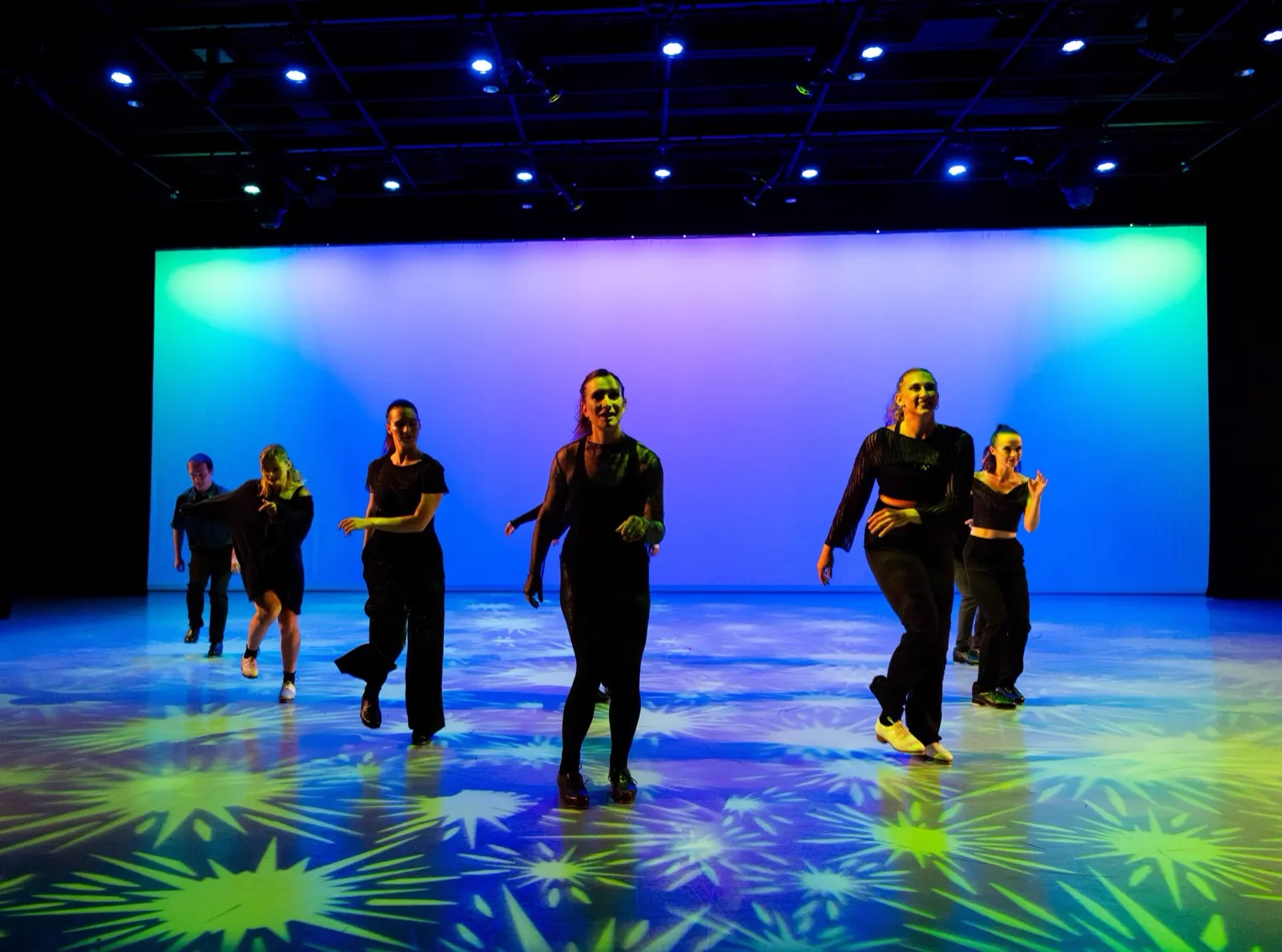 dwdCOLLECTIVE walking downstage together