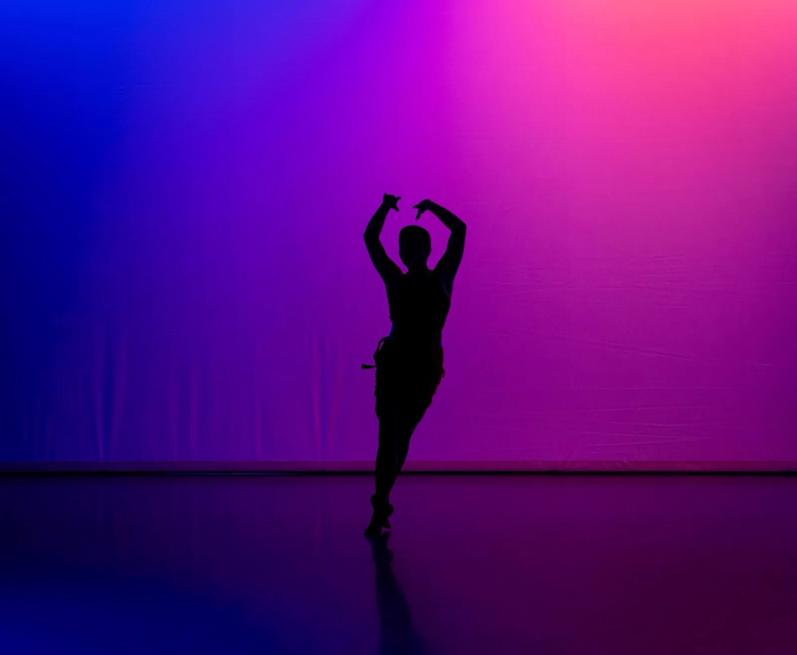 A dwdCOLLECTIVE dancer alone in the light