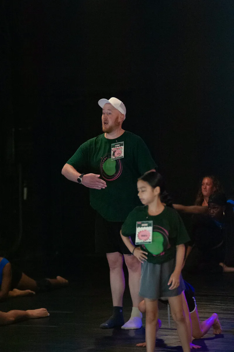 Dixon coaching a young dancer at dwdCON