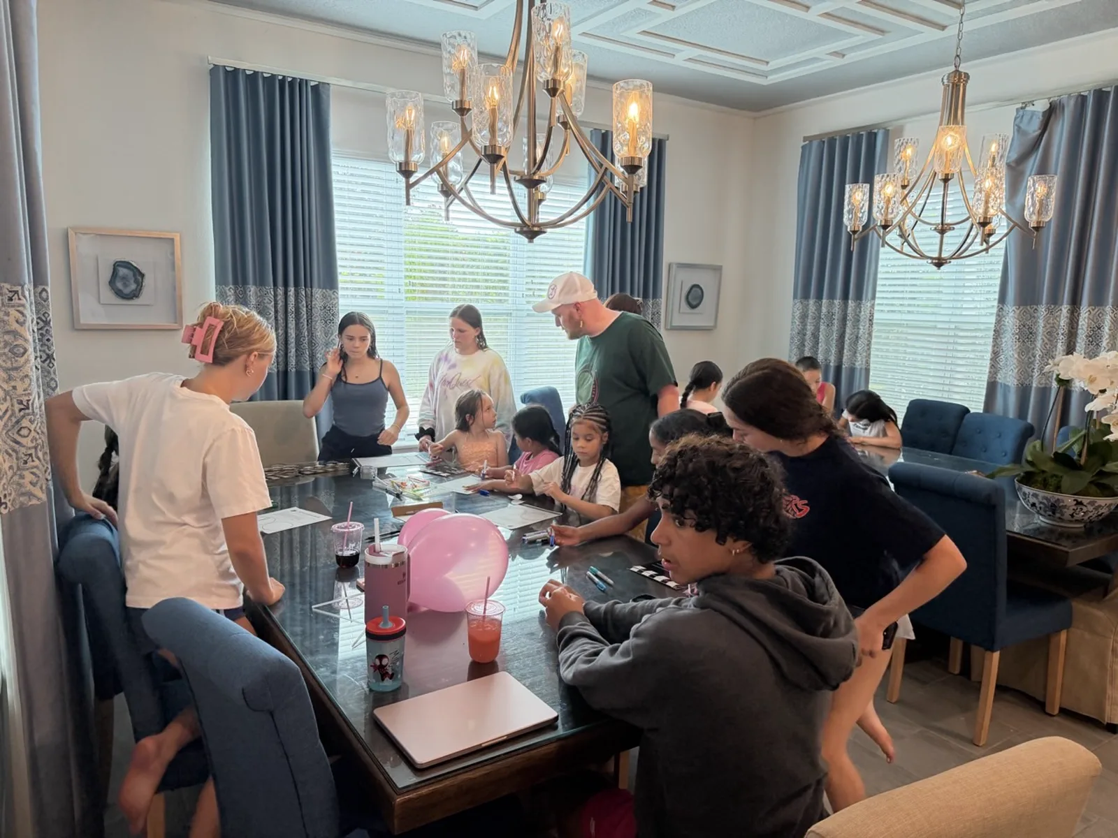 Dixon and dancers reviewing season designs around the table