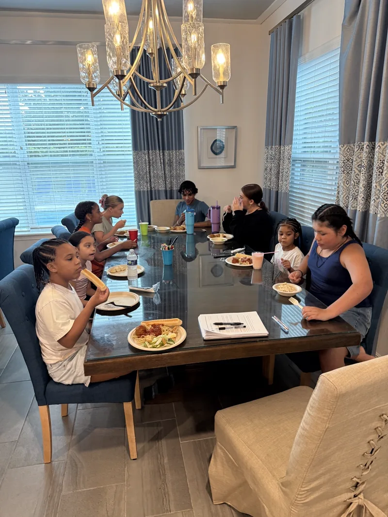 The company at dinner during the kickoff sleepover