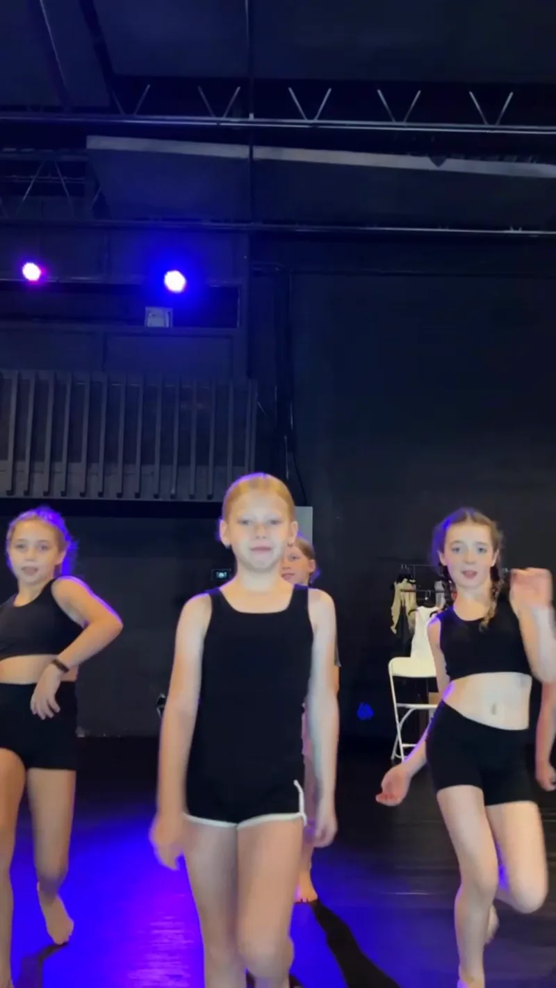 Young dancers mid-combo at the open house